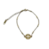 Bracelet avec croix grecque et chaine dorée