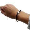 Bracelet élastique bleu marine avec croix